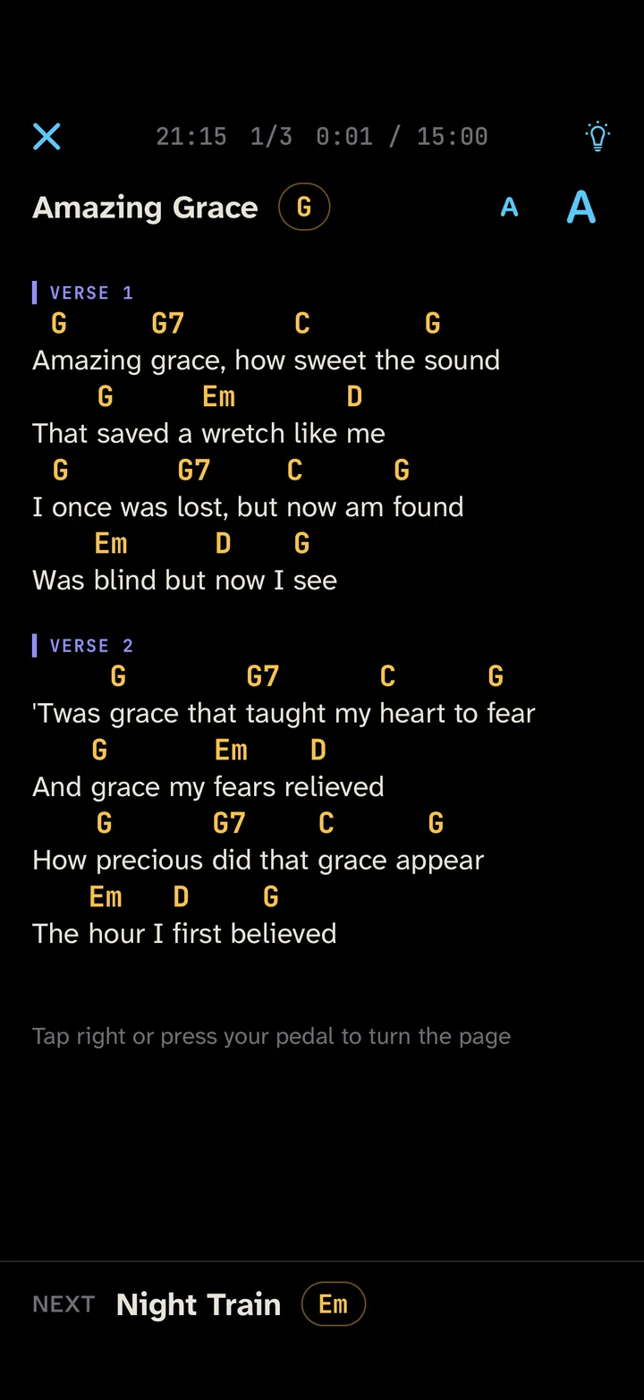 Setlists in stage mode: a song with chords above the lyrics, in large type on a dark background.